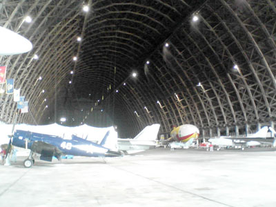 The interior of the airship hangar, with some of the vintage warbirds owned by the Tillamook Air Museum, including a Navy F4U Corsair, in the foreground. The interior of the blimp hangar in Tillamook, now home to the Tillamook Air Museum. This hangar is the only one of the remaining World War II blimp hangars that's open to the public.