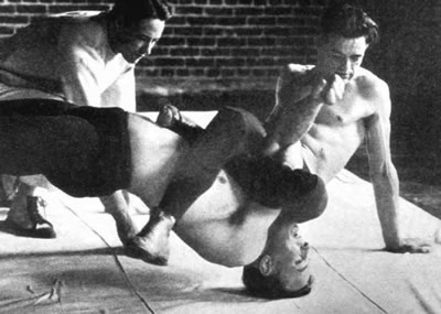 Oregon State University legend Robin Reed pins a teammate Robin Reed pinning a teammate at Oregon State (then OAC) in the 1920s.