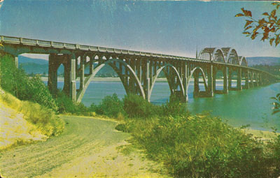 Many people considered this the best-looking of McCullough's Oregon Coast bridges, which, as you likely know, is saying something. It's gone now. This was the bridge across Alsea Bay at Waldport, which crumbled due to the use of salty beach sand in mixing the mortar of which it was built.