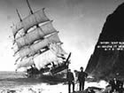 The Glenesslin, under almost full sail, grinds against the rocks at the base of Neahkahnie Mountain.