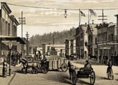 A street scene in downtown Astoria from the "golden age of  shanghaiing" in Oregon, featuring the Odd Fellows Temple, drawn by the staff artist at The West Shore, a literary magazine based in  Portland, and published in 1887.