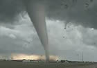 This is a screenshot from a YouTube video posted by "Newsiegirl2008" after the Aumsville tornado. It's video footage of the funnel cloud actually on the ground, picking up stuff -- in Aumsville, Oregon, December 2010.