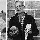 Howard A. Black, the curator of the Grant County Museum in Canyon City, shows the skull of murderer Berry Way, hanged for murder near Canyon City in 1864 – the same year hot-tempered 15-year-old Hank Vaughan shot two people in Canyon City. Had Hank’s aim been better, this would likely have been his fate as well. (Image: Ben Maxwell/ Salem Public Library)
